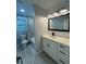 Bright bathroom featuring modern vanity, neutral tones, and shower at 695 Pine Shadows Dr, Dallas, GA 30157