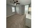 Comfortable bedroom with a ceiling fan, carpet, and neutral walls at 695 Pine Shadows Dr, Dallas, GA 30157