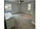 Cozy bedroom featuring neutral carpet, two windows and grey paint at 695 Pine Shadows Dr, Dallas, GA 30157