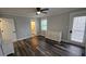 Bedroom featuring a ceiling fan, hardwood floors, closet and access to an ensuite bathroom at 695 Pine Shadows Dr, Dallas, GA 30157