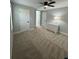 Spacious bedroom with a ceiling fan, carpet and two doors at 695 Pine Shadows Dr, Dallas, GA 30157
