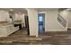 Modern kitchen with stainless steel appliances, ample cabinet space, and stylish countertops open to the staircase at 695 Pine Shadows Dr, Dallas, GA 30157