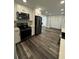 Spacious kitchen with stainless steel appliances and built in cabinets perfect for ample storage at 695 Pine Shadows Dr, Dallas, GA 30157