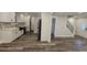 Modern kitchen with stainless steel appliances, ample cabinet space, and stylish countertops near the front door at 695 Pine Shadows Dr, Dallas, GA 30157