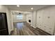 Open floor plan view from kitchen to the bright living room with fireplace and built-in cabinets at 695 Pine Shadows Dr, Dallas, GA 30157