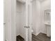 Clean powder room with a pedestal sink and a closet at 12093 Conrad Circle, Hampton, GA 30228