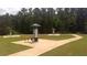 Scenic walking trail with exercise stations surrounded by lush greenery, perfect for outdoor activities at 12093 Conrad Circle, Hampton, GA 30228