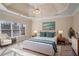 Bright staged bedroom with tray ceiling, a large window and stylish decor at 2165 Parkview Nw Run, Atlanta, GA 30318