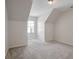 Cozy bedroom with carpeted floors, angled ceilings, and natural light at 2165 Parkview Nw Run, Atlanta, GA 30318