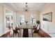 Elegant dining room with hardwood floors, a chandelier, and detailed trim work at 2165 Parkview Nw Run, Atlanta, GA 30318