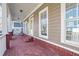 Covered front porch with brick flooring, white columns, and ample space for relaxing at 2165 Parkview Nw Run, Atlanta, GA 30318