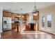 Well-lit kitchen with stainless steel appliances, a center island, and access to an outdoor deck at 2165 Parkview Nw Run, Atlanta, GA 30318