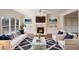 Bright living room with a fireplace, built-in cabinets, and stylish decor at 2165 Parkview Nw Run, Atlanta, GA 30318