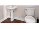 Clean powder room featuring pedestal sink and wood flooring at 2165 Parkview Nw Run, Atlanta, GA 30318