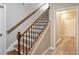 Wooden staircase with decorative iron railings at 2165 Parkview Nw Run, Atlanta, GA 30318