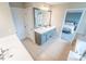 En Suite bathroom with dual sinks, vanity, and tile floor connecting to bedroom at 4621 Wehunt Commons Se Dr # 7, Smyrna, GA 30082