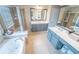 Spacious bathroom boasting double vanities, a soaking tub, and a glass-enclosed shower at 4621 Wehunt Commons Se Dr # 7, Smyrna, GA 30082
