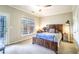 Cozy bedroom with outdoor access, a wooden bed frame, and natural light at 4621 Wehunt Commons Se Dr # 7, Smyrna, GA 30082