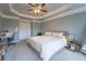 Comfortable bedroom featuring a ceiling fan, cozy carpet, and a soothing, neutral color palette at 4621 Wehunt Commons Se Dr # 7, Smyrna, GA 30082