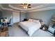Bedroom featuring tray ceiling, modern fan, and neutral decor offering a calming and inviting space at 4621 Wehunt Commons Se Dr # 7, Smyrna, GA 30082