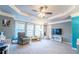 Bright, neutral room features lots of natural light, recessed ceiling with fan, and plenty of carpeted floor space at 4621 Wehunt Commons Se Dr # 7, Smyrna, GA 30082