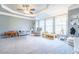 Spacious, carpeted room with recessed ceiling, ceiling fan, lots of natural light and space for relaxing and playing at 4621 Wehunt Commons Se Dr # 7, Smyrna, GA 30082