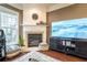 Cozy fireplace nestled between a window and TV, atop a stylish shag rug at 4621 Wehunt Commons Se Dr # 7, Smyrna, GA 30082