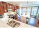Bright kitchen with stainless steel appliances, wood floors, marble counters, and a view of the backyard at 4621 Wehunt Commons Se Dr # 7, Smyrna, GA 30082