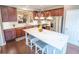 Bright eat-in kitchen features stainless steel appliances, a large center island with seating and white countertops at 4621 Wehunt Commons Se Dr # 7, Smyrna, GA 30082