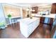 Open kitchen featuring an island with seating, white cabinets, and hardwood floors at 4621 Wehunt Commons Se Dr # 7, Smyrna, GA 30082