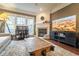 Cozy living room featuring a fireplace, large windows, and rustic coffee table at 4621 Wehunt Commons Se Dr # 7, Smyrna, GA 30082