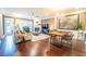 Open-concept living room with fireplace, large windows, and hardwood floors at 4621 Wehunt Commons Se Dr # 7, Smyrna, GA 30082