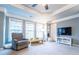 Inviting living room with soft gray walls, and multiple windows at 4621 Wehunt Commons Se Dr # 7, Smyrna, GA 30082