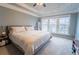 Calming main bedroom with ample natural light, plush carpeting, and a ceiling fan at 4621 Wehunt Commons Se Dr # 7, Smyrna, GA 30082
