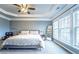 Spacious bedroom featuring tray ceilings, large windows, and plush carpeting at 4621 Wehunt Commons Se Dr # 7, Smyrna, GA 30082