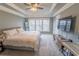 Spacious main bedroom with a tray ceiling, large windows, and plush carpeting at 4621 Wehunt Commons Se Dr # 7, Smyrna, GA 30082