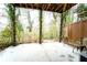 Covered patio space with mature landscaping and natural light at 4621 Wehunt Commons Se Dr # 7, Smyrna, GA 30082