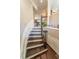 Elegant staircase with hardwood steps and wrought iron railing, ascending to the upper level at 4621 Wehunt Commons Se Dr # 7, Smyrna, GA 30082