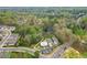 Aerial view featuring a home surrounded by lush trees and landscaping in a serene neighborhood setting at 161 Grace Cir, Acworth, GA 30102