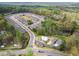 Beautiful aerial view of a well-planned community with lush green spaces, pond, and access to boat storage at 161 Grace Cir, Acworth, GA 30102