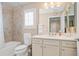 Bathroom featuring a shower-tub combo and white cabinets at 161 Grace Cir, Acworth, GA 30102