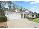 Attractive single-story home featuring a spacious driveway, well-kept lawn, and a charming front porch at 161 Grace Cir, Acworth, GA 30102
