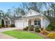 Inviting single-story home with manicured lawn and cozy front porch seating, perfect for relaxing outdoors at 161 Grace Cir, Acworth, GA 30102