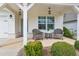Cozy front porch featuring comfortable seating, stylish lighting, and a charming spot to enjoy the outdoors at 161 Grace Cir, Acworth, GA 30102