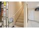 Stairway in garage, that provides easy access to upper level, with safety handrail at 161 Grace Cir, Acworth, GA 30102