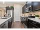 Kitchen with stainless steel appliances and granite countertops at 161 Grace Cir, Acworth, GA 30102