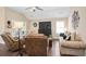 Inviting living area with a plush sofa, comfortable recliners, and ample natural light from the shuttered windows at 161 Grace Cir, Acworth, GA 30102