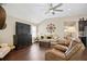 Spacious living room boasts a vaulted ceiling, dark wood floors, and an open layout perfect for entertaining at 161 Grace Cir, Acworth, GA 30102