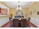 Traditional dining room boasts a large chandelier and elegant decor at 19 Lindley Nw Ave, Marietta, GA 30064