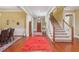 Spacious foyer featuring hardwood floors, staircase, and elegant decor leading to other rooms at 19 Lindley Nw Ave, Marietta, GA 30064